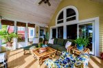 Plenty of seating for gathering in the porch sunroom. Gather and enjoy build precious memories in this spectacular room. 